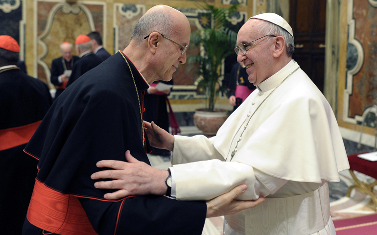 Pope Francis greets Cardinal Tarcisio Bertone, former Vatican secretary of state, following a meeting with the College of Cardinals on Friday in the Vatican's Clementine Hall. (CNS/L'Osservatore Romano) 