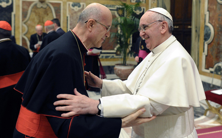 Pope Francis greets Cardinal Tarcisio Bertone, former Vatican secretary of state, following a meeting with the College of Cardinals on Friday in the Vatican's Clementine Hall. (CNS/L'Osservatore Romano)
