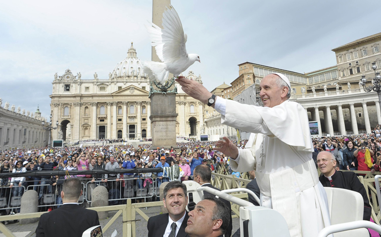 Pope Francis holds a dove before his weekly audience Wednesday in St. Peter's Square at the Vatican. (CNS/Reuters/L'Osservatore Romano)