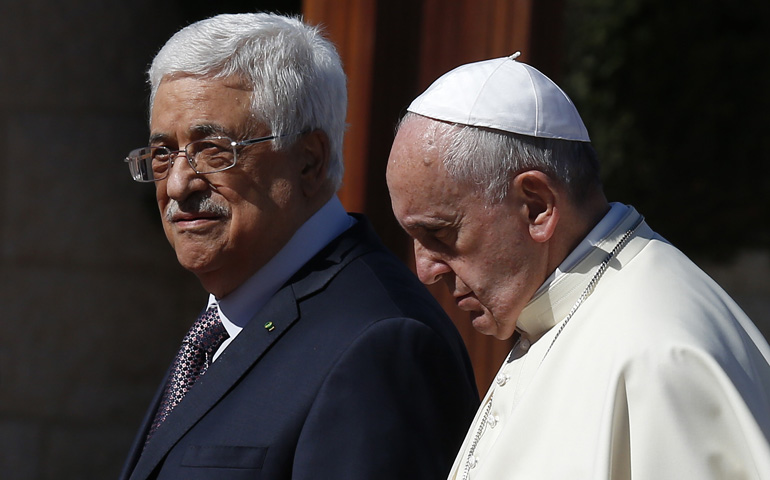 Pope Francis walks with Palestinian President Mahmoud Abbas on May 25, 2014, at the presidential palace in Bethlehem, West Bank. (CNS/Paul Haring)