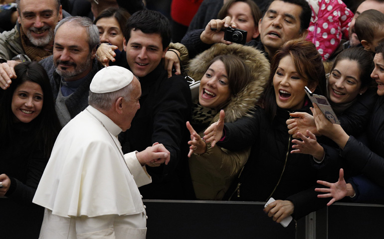 Pope Francis arrives to lead his general audience Wednesday in Paul VI hall at the Vatican. (CNS/Paul Haring)