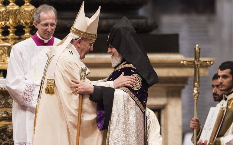 Pope Francis embraces Catholicos Karekin II of Etchmiadzin, patriarch of the Armenian Apostolic Church, during Mass on Sunday in St. Peter's Basilica at the Vatican to mark the 100th anniversary of the Armenian genocide. (CNS/Cristian Gennari)