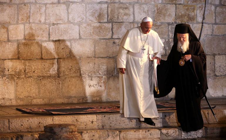 Pope Francis walks with Ecumenical Patriarch Bartholomew of Constantinople on May 25 at Jerusalem's Church of the Holy Sepulcher. (CNS/EPA/Abir Sultan)
