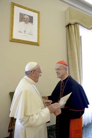 Pope Francis talks with the outgoing Vatican secretary of state, Cardinal Tarcisio Bertone, during the cardinal's farewell ceremony Tuesday at the Vatican. (CNS/Reuters/L'Osservatore Romano)