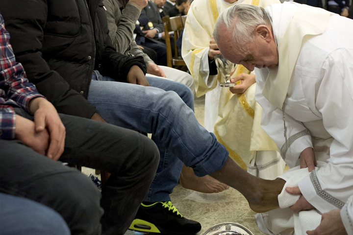 Pope Francis washes the foot of a prison inmate March 28, 2013, during the Holy Thursday Mass at Rome's Casal del Marmo prison for minors. (CNS/Reuters/L'Osservatore Romano)