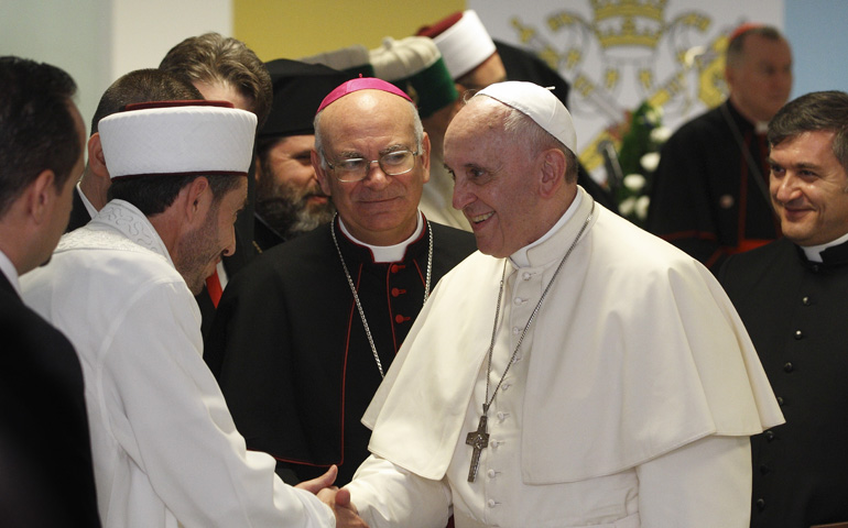 Pope Francis greets a Muslim representative during a meeting with leaders of other religions Sept. 21 at the Catholic University of Our Lady of Good Counsel in Tirana, Albania. (CNS/Paul Haring)