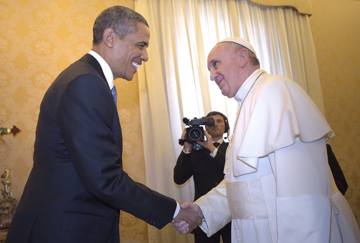 U.S. President Barack Obama shakes hands with Pope Francis during a private audience Thursday at the Vatican. (CNS/Stefano Spaziani, pool) 