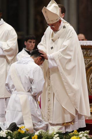 Pope Francis ordains a new priest April 26 in St. Peter's Basilica at the Vatican. (CNS/Paul Haring)