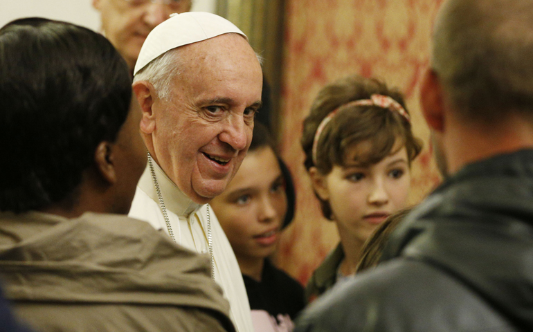Pope Francis leads a meeting with the poor in the archbishop's residence Oct. 4 in Assisi, Italy. The meeting was in the famous "stripping room," where St. Francis stripped off his rich clothes, gave them to his father and began a life of poverty dedicated to Christ. (CNS/Paul Haring) 
