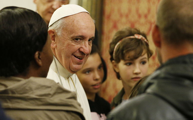 Pope Francis leads a meeting with the poor in the archbishop's residence Oct. 4 in Assisi, Italy. The meeting was in the famous "stripping room," where St. Francis stripped off his rich clothes, gave them to his father and began a life of poverty dedicated to Christ. (CNS/Paul Haring)