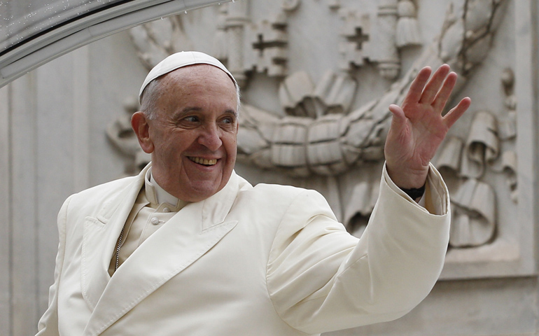Pope Francis waves as he leaves his general audience Wednesday in St. Peter's Square at the Vatican. (CNS/Paul Haring)