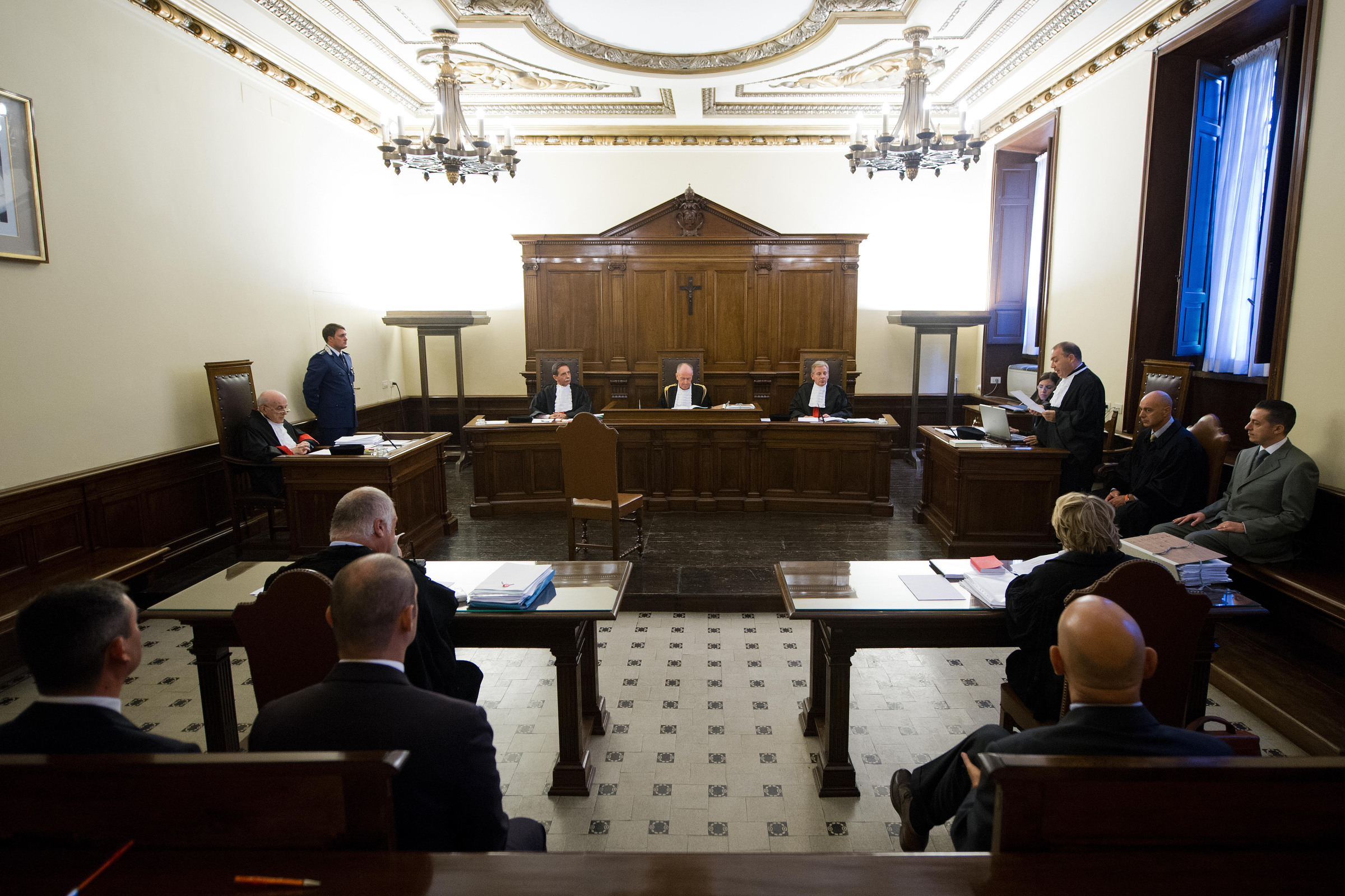 Pope Benedict XVI's former butler Paolo Gabriele, seated at right in gray suit, attends the first day of his trail in a courtroom at the Vatican Sept. 29. (CNS/L'Osservatore Romano) 