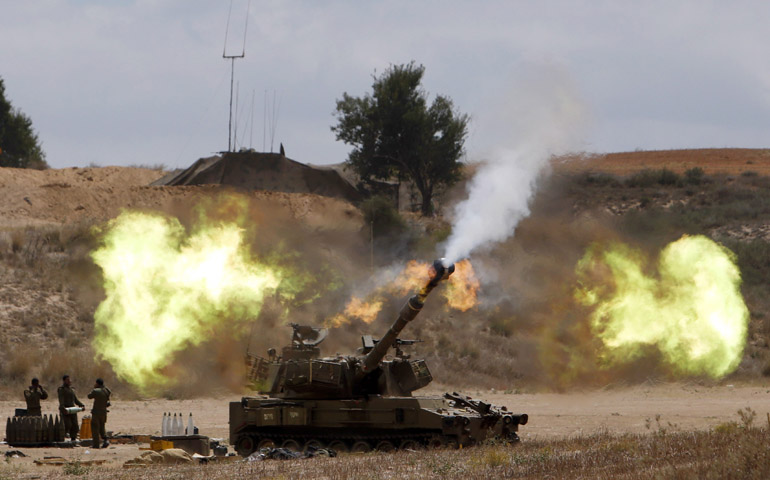 An Israeli mobile artillery unit fires toward the Gaza Strip on Friday. (CNS/Reuters/Nir Elias)