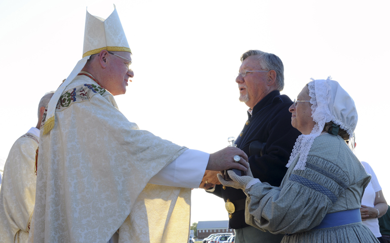 New York Cardinal Timothy Dolan receives the offertory gifts from Civil War reenactors during Mass July 6 at Gettysburg, Pa., as part of the 150th anniversary of the Battle of Gettysburg. (CNS/The Catholic Witness/Emily M. Albert)
