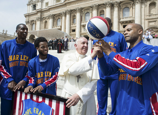 Pope Francis plays with a basketball with members of the Harlem Globetrotters basketball team during his weekly audience May 6 in St. Peter's Square at the Vatican. (CNS/Reuters/L'Osservatore Romano)