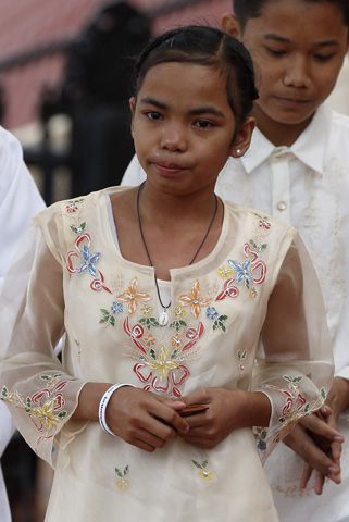 Glyzelle Palomar walks to her seat after greeting Pope Francis during a meeting Sunday with young people at the University of St. Thomas in Manila, Philippines. (CNS/Paul Haring)