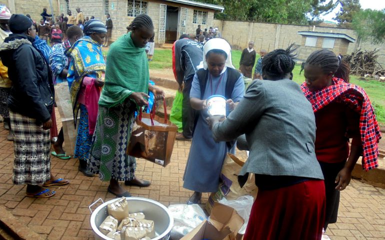 Sr. Anne Grace shares food with women who are helped by the Missionary Sisters of the Precious Blood near Narirobi, Kenya. (Provided photo)