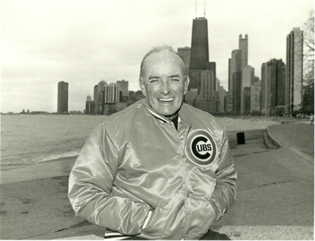 Fr. Andrew Greeley with the skyline of his hometown Chicago. (Photo from author's private collection.)