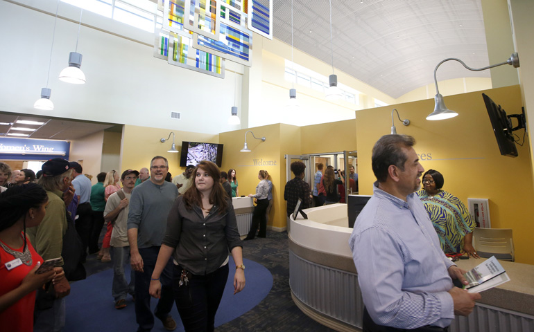 People tour the newly built Kearney Center, which opened for a public showing in Tallahassee, Fla., April 2. (Tallahassee Democrat/Joe Rondone)