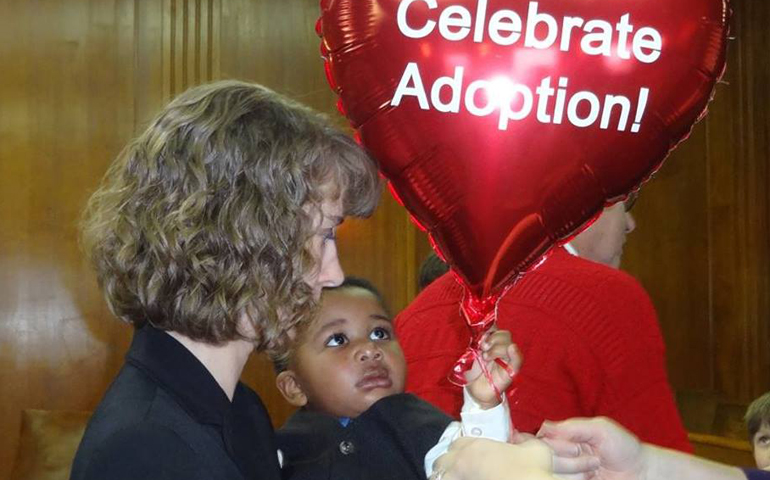 Heidi Russell with son D.J. on adoption day in 2014 in a courtroom near Milwaukee (Janie Russell)