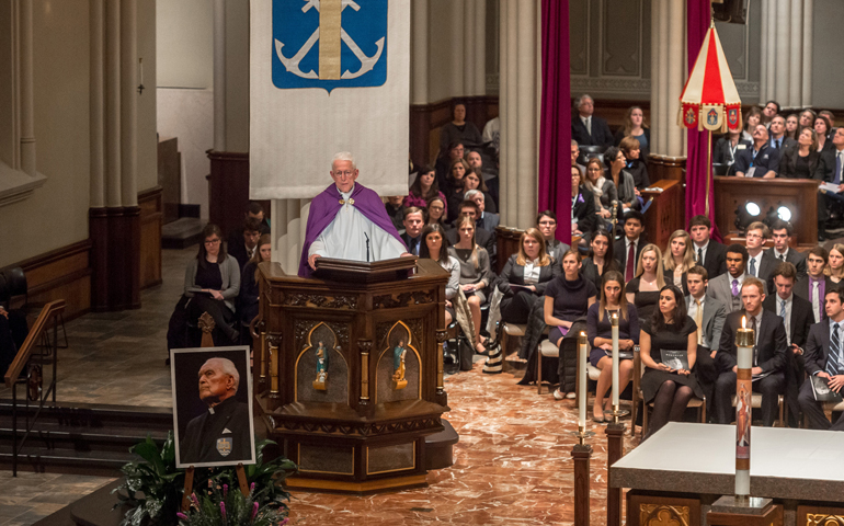 Holy Cross Fr. Edward Malloy, who retired in 2005 as the 16th president of the University of Notre Dame, reflects on the life of Fr. Theodore Hesburgh at Hesburgh's wake Tuesday in the Basilica of the Sacred Heart. (CNS/University of Notre Dame/Matt Cashore)