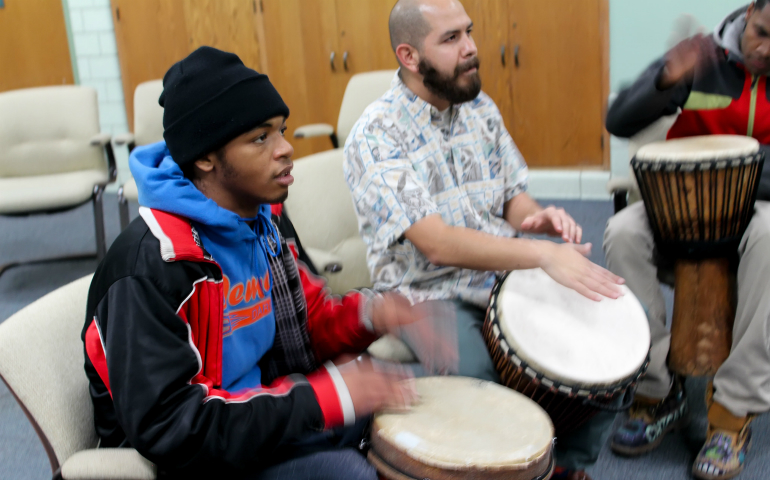 Willie Davis, left, participating in one of the drumming circles at Precious Blood Center. (Juan Acuna)
