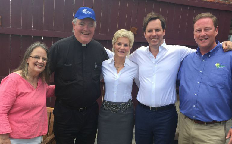 At the Catholic Action Center, from left to right: Director Ginny Ramsey; Fr. Dan Noll, pastor of Mary Queen of the Holy Rosary in Lexington; Laura Babbage, the center's chaplain; Adam Edelen; and Jamie Clark, president of Synergy Homes LLC. (Bob Babbage)