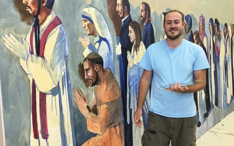 Cincinnati artist John McCoy paints the mural for All Saints Church in Alpena, Mich. (Courtesy of John McCoy)