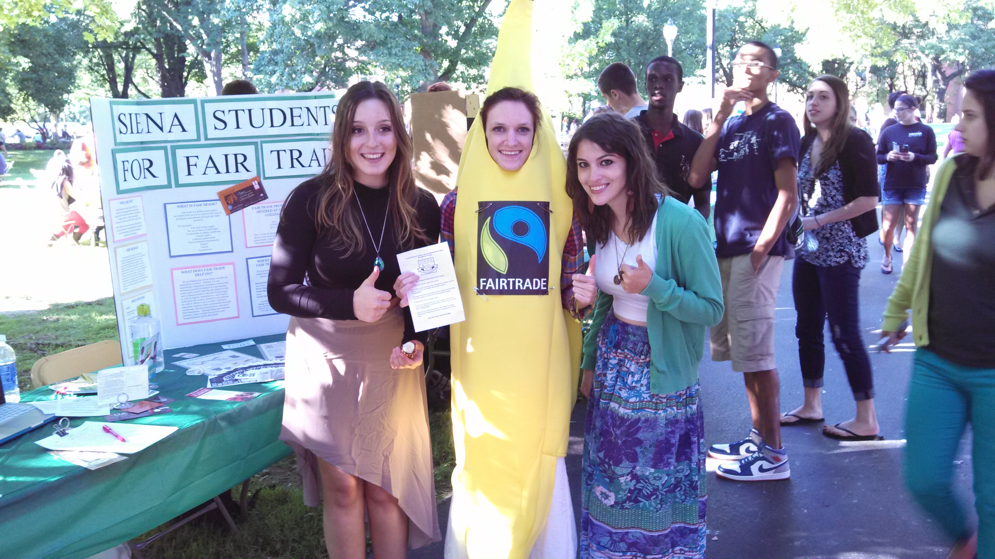 From left, Monika Ostrowidzki, Casey Gallagher and Andreia Marcuccio promote Siena Students for Fair Trade at a college-wide club fair in September 2013 at Siena College in Loudonville, N.Y. (Shannon O'Neill)