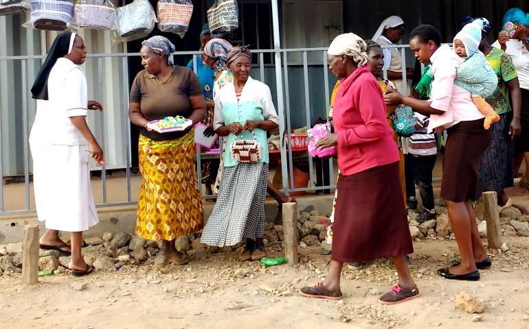 Now that the women peacemakers group has a storefront, fashioned from a container, they are able to hold regular meetings and have even started an informal lending, or “table banking” group. (GSR photo/Melanie Lidman)