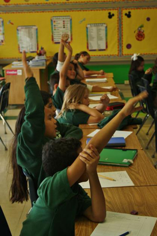 Third graders practice Spanish vocabulary in Waydenia Nieves' classroom at Archbishop Borders School in Baltimore, Md. (GSR/Tara García Mathewson)