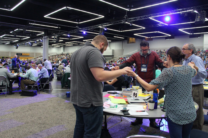 Delegates at the 2016 United Methodist General Conference in Portland, Ore., respond in prayer May 18 after hearing from Bishop Bruce Ough. (RNS/Emily McFarlan Miller)