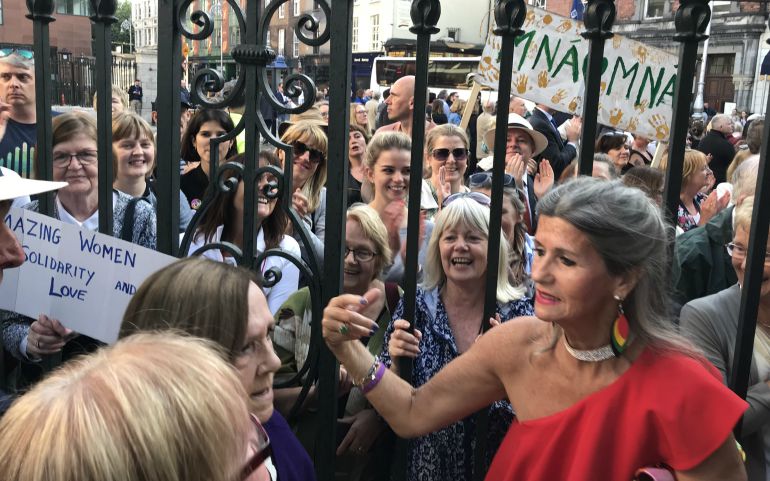Gabrielle O'Gorman, in red, attends the Aug. 26 "Stand4Truth" demonstration in Dublin. O'Gorman, 73, spent six weeks at the Sean McDermott Street laundry before she was sent to the laundry run by the Good Shepherd Sisters in Limerick for two and a half years. (Provided photo)