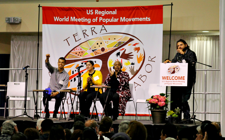 World Meeting of Popular Movements co-founder Juan Grabois, right, addresses other grassroots leaders and the assembly in Modesto, Calif., Feb. 16. (NCR photo/Brian Roewe)