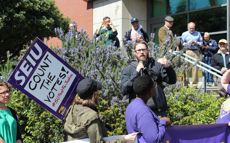 Ben Stork speaks at a union rally at Seattle University April 14. (SEIU Local 925)
