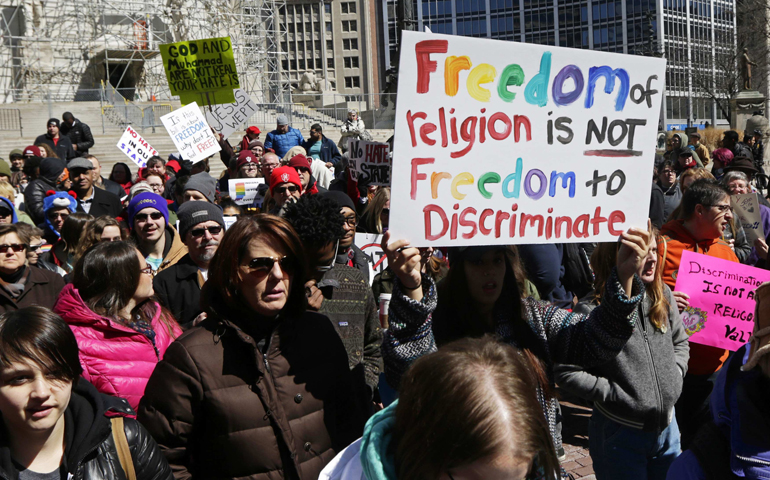 Demonstrators rally Saturday at Monument Circle in Indianapolis to protest a religious freedom bill signed in to law by Indiana Gov. Mike Pence. (CNS/Reuters/Nate Chute)
