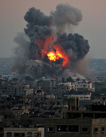 Smoke rises after an Israeli airstrike in Gaza City on Tuesday. (CNS/EPA/Mohammed Saber)