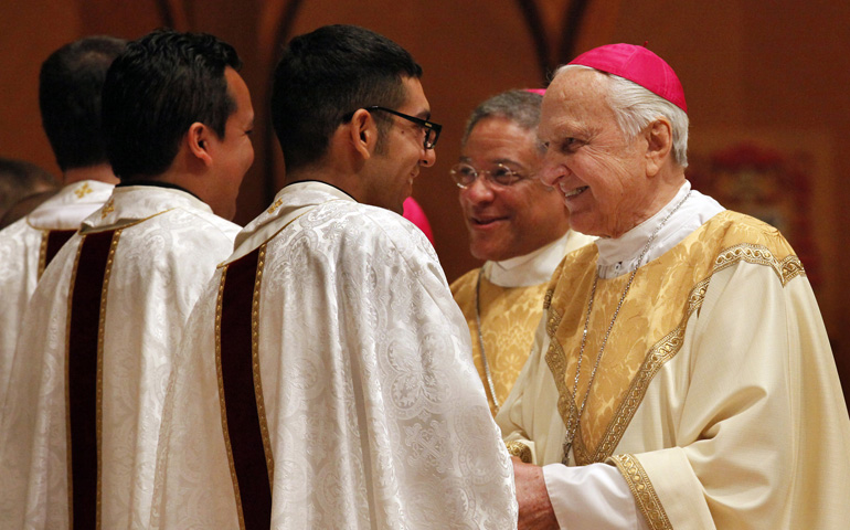 Retired Chicago Auxiliary Bishop Thad J. Jakubowski congratulates newly ordained priests at Holy Name Cathedral in Chicago in 2011. Jakubowski died Sunday at his home at St. Mary of Providence School in Chicago. He was 89. (CNS/Catholic New World/Karen Callaway)