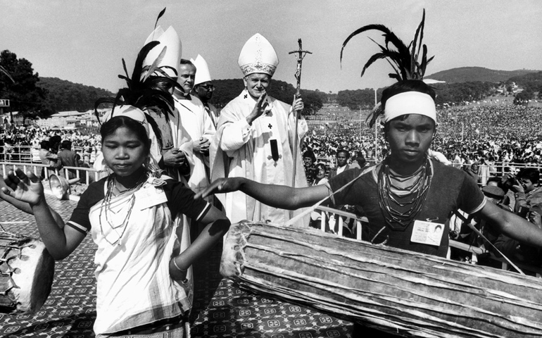 Local youths perform a song as Pope John Paul II visits Shillong in India in 1986. (CNS photo)
