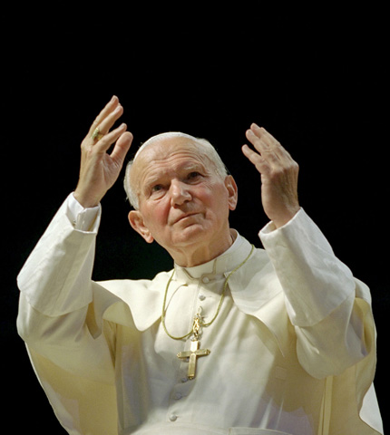 Blessed John Paul II gestures to the crowd at World Youth Day in Denver in 1993. (CNS file photo/Joe Rimkus Jr.)