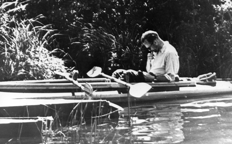 Fr. Karol Wojtyla, the future Pope John Paul II, reads in a kayak in 1955. (CNS) 