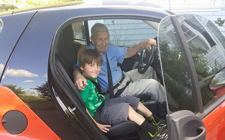 Joe Girzone with Athen in the used Smart car, which Girzone called little hell dog