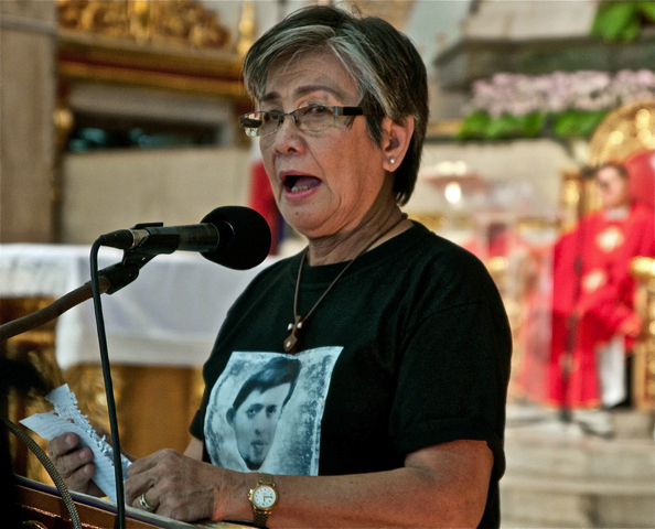 "Your flock has been thirsting for words of hope from their bishop," Edita Burgos, mother of Jonas Burgos, who has been missing since 2007. Jonas Burgos' photo is printed on her shirt. (Roy Lagarde)