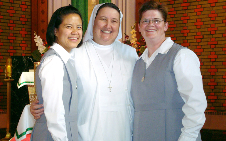 Sr. Jennifer Kane, right, stands with Sisters Elfie Del Rosario, left, and Phyllis Neaves following her official entrance into the novitiate in 2011. Kane will make her first profession of vows with the Salesian Sisters of St. John Bosco in August. (CNS/Courtesy Sr. Jennifer Kane) 