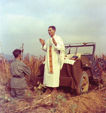 U.S. Army chaplain Fr. Emil Kapaun, who died May 23, 1951, in a North Korean prisoner of war camp, is pictured celebrating Mass from the hood of a jeep Oct. 7, 1950, in South Korea. (CNS/courtesy U.S. Army medic Raymond Skeehan) 