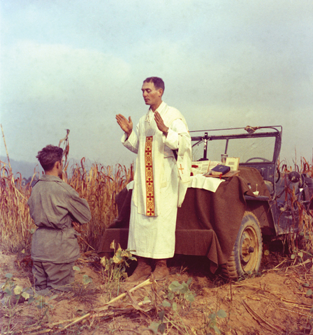 U.S. Army chaplain Fr. Emil Kapaun, who died May 23, 1951, in a North Korean prisoner of war camp, is pictured celebrating Mass from the hood of a jeep Oct. 7, 1950, in South Korea. (CNS/courtesy U.S. Army medic Raymond Skeehan)