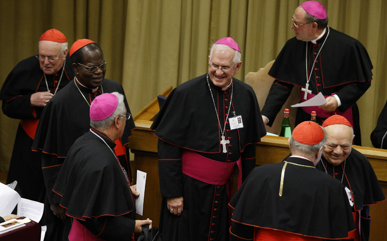 Archbishop Joseph Kurtz of Louisville, Ky., center, arrives for the afternoon session on the first working day of the extraordinary Synod of Bishops on the family Monday at the Vatican. (CNS/Paul Haring) 