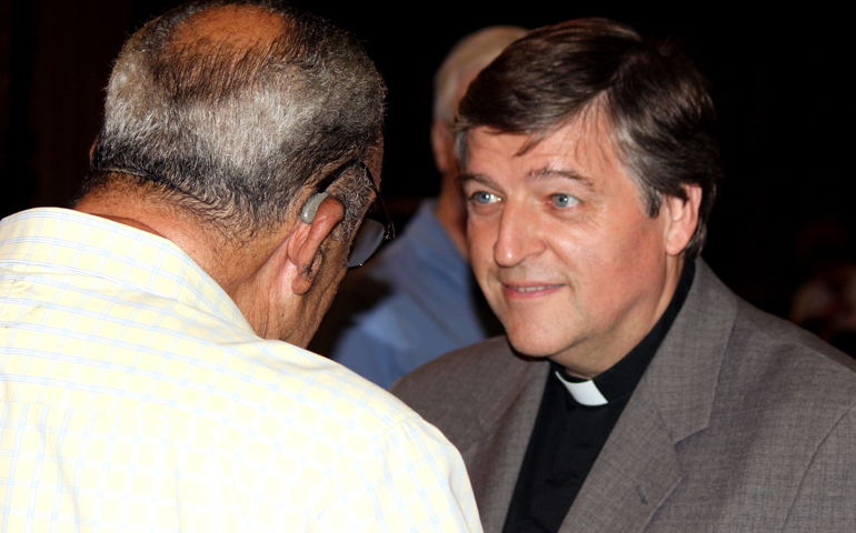 Austrian Fr. Helmut Schüller speaks to an attendee of his talk Friday at Westminster Presbyterian Church in Pasadena, Calif. (Gabrielle Canon)