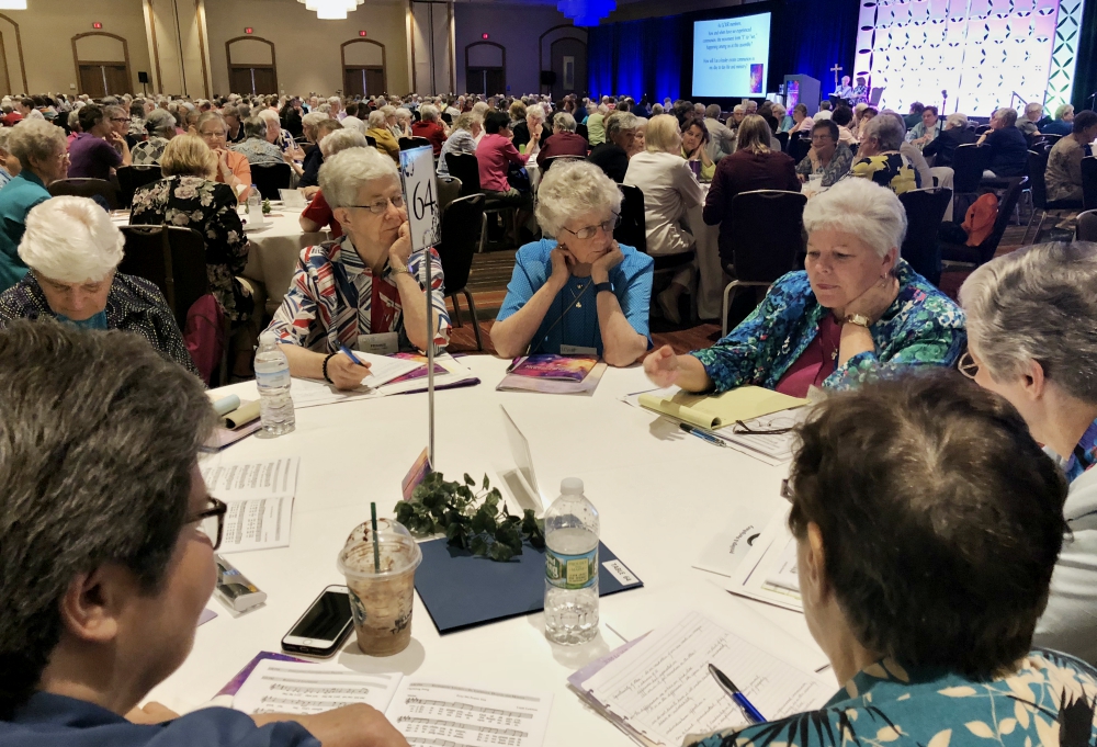 Sisters share their thoughts with the other sisters at their tables after a keynote speaker at the 2018 Leadership Conference of Women Religious annual assembly, held Aug. 7-10 in St. Louis. (GSR file photo) Sisters share their thoughts with the other sisters at their tables after a keynote speaker at the 2018 Leadership Conference of Women Religious annual assembly, held Aug. 7-10 in St. Louis. (GSR file photo)