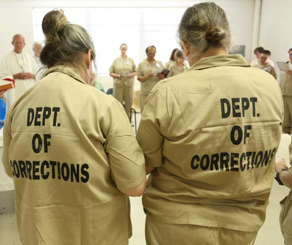 Carol Elizabeth Lovingood, left, and Carla Rae Hopwood at a June 2014 Mass at Lee Arrendale State Prison in Alto, Georgia. (CNS/Georgia Bulletin /Michael Alexander)